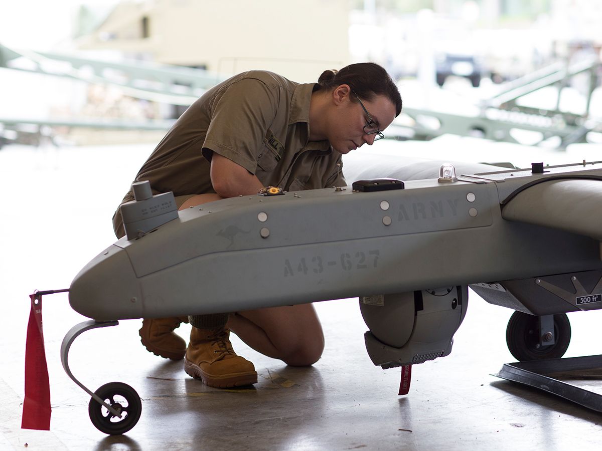 A member of the Army works on equipment.