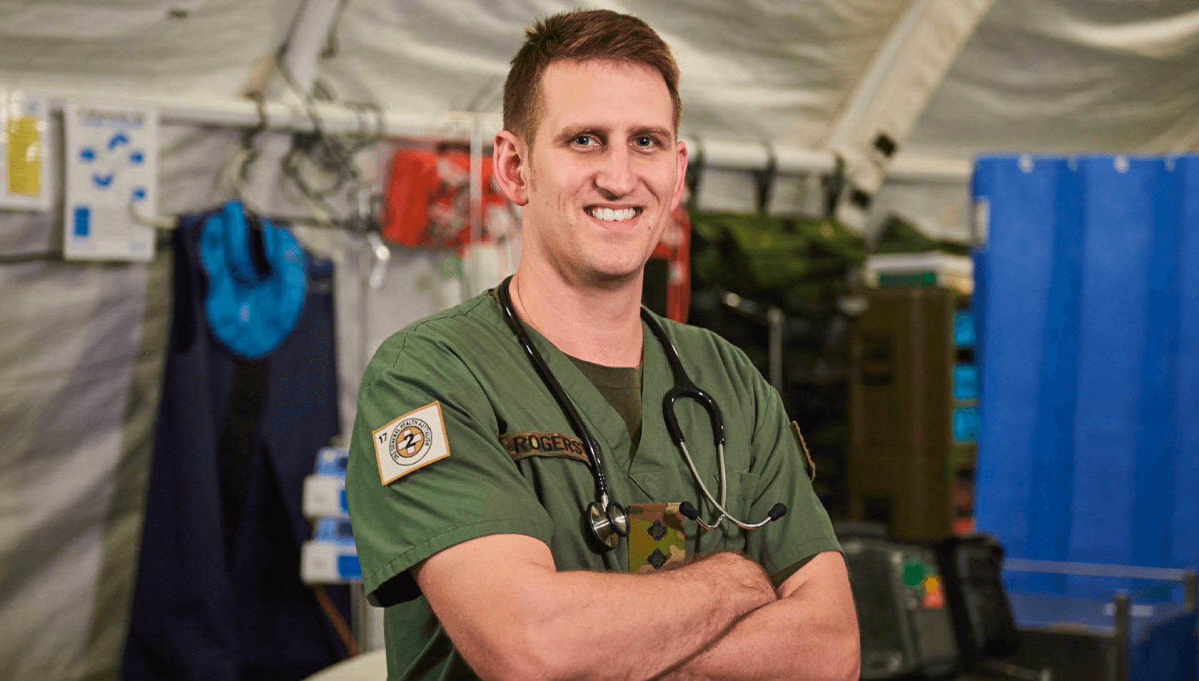 An Army medic smiles at camera.