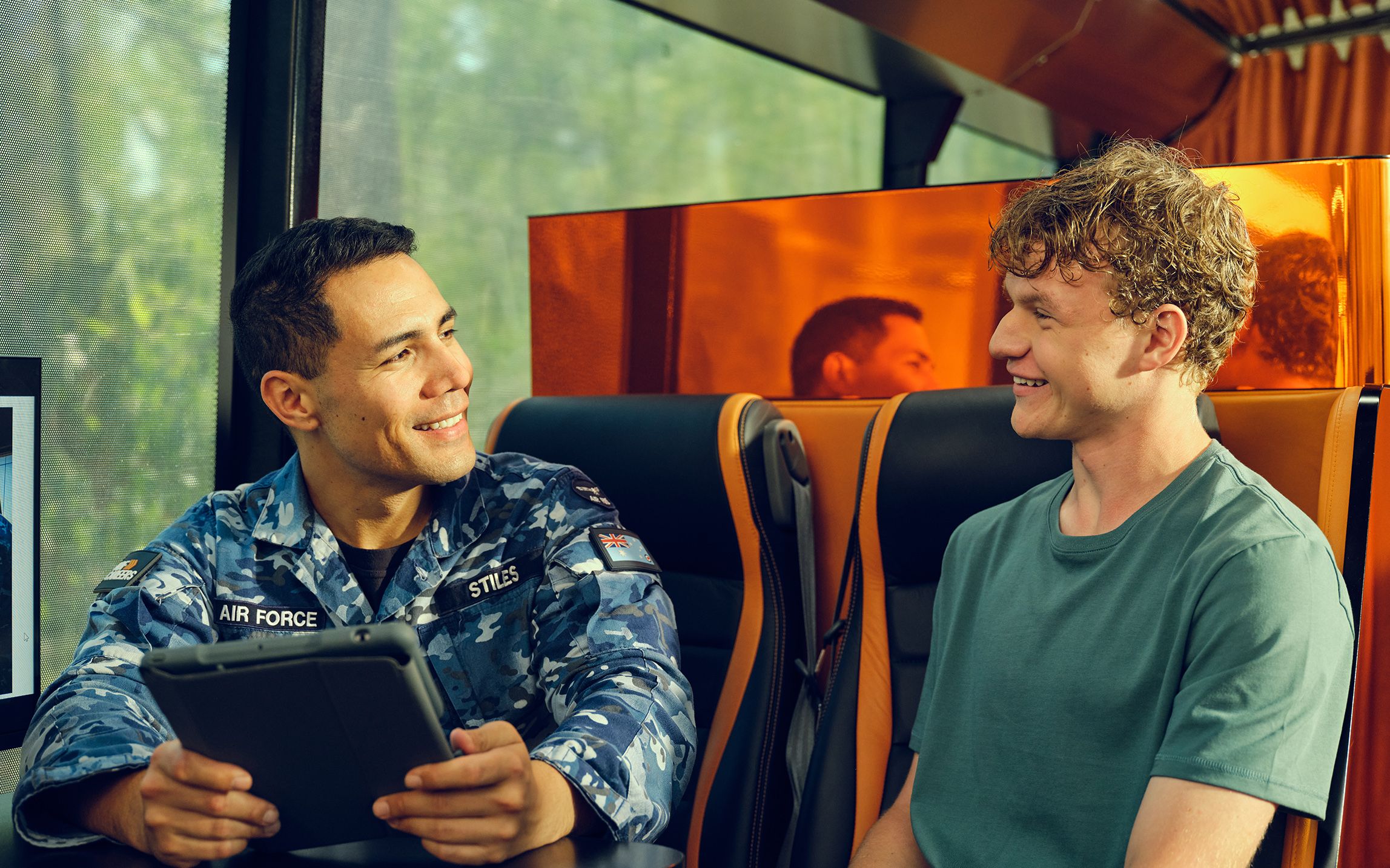 A member of the ADF speaking to a candidate at the Mobile ADF Careers Centre.