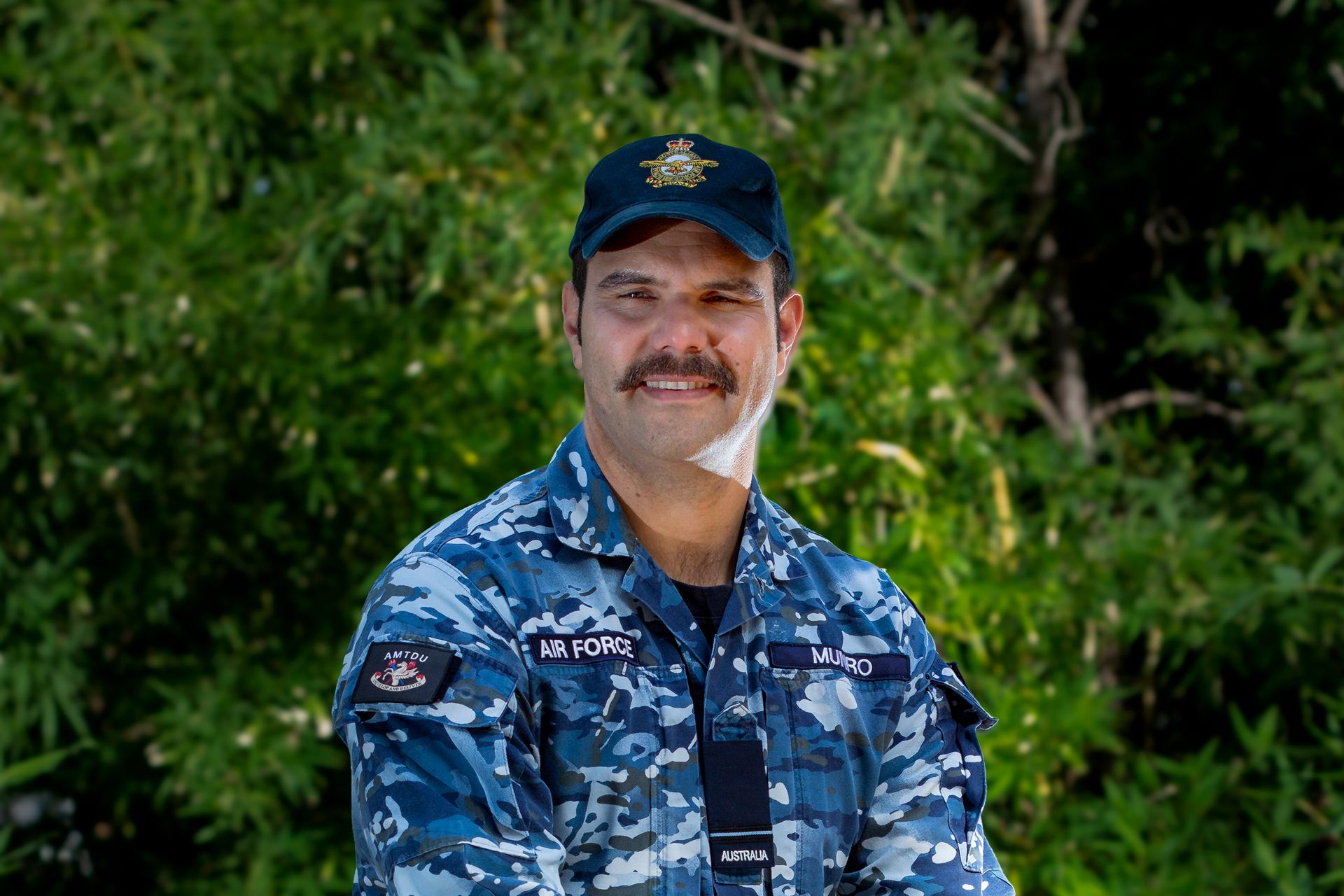 Loadmaster Coomara smiles at camera.