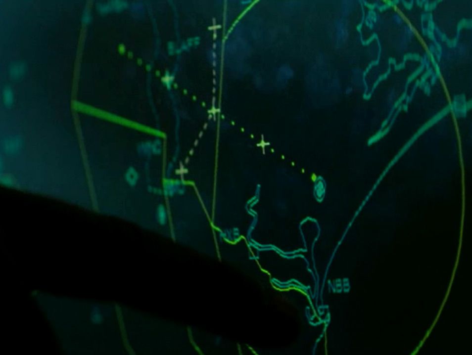 A digital surveillance map is illuminated.