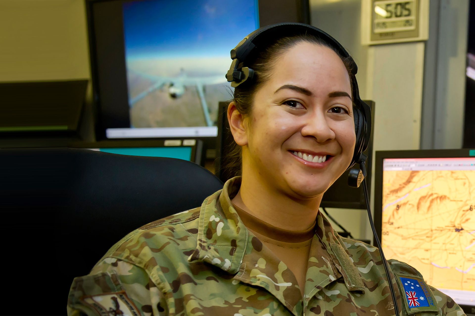 Air Intelligence Analyst Tara smiles at camera.