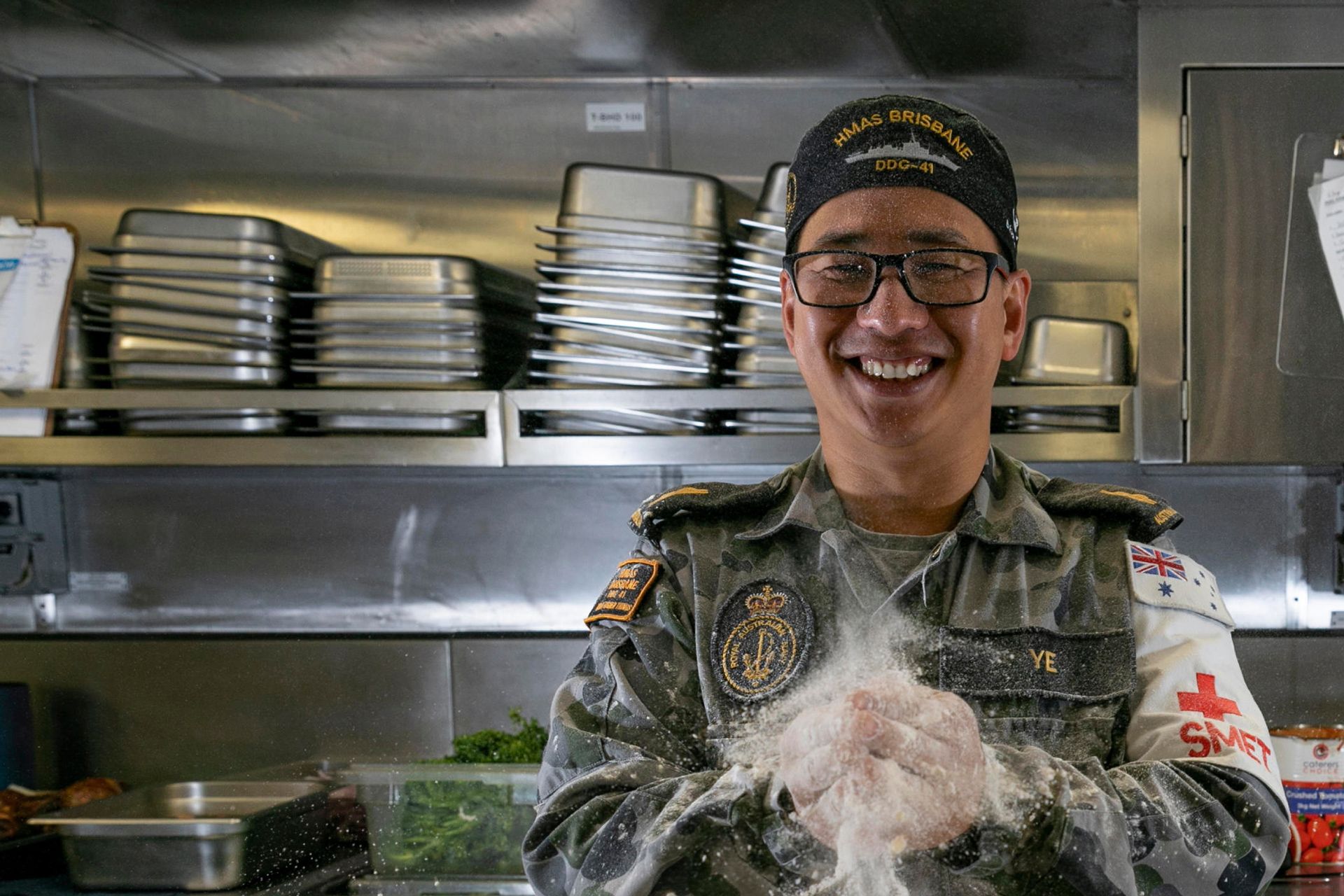 A Navy Chef working in the kitchen.