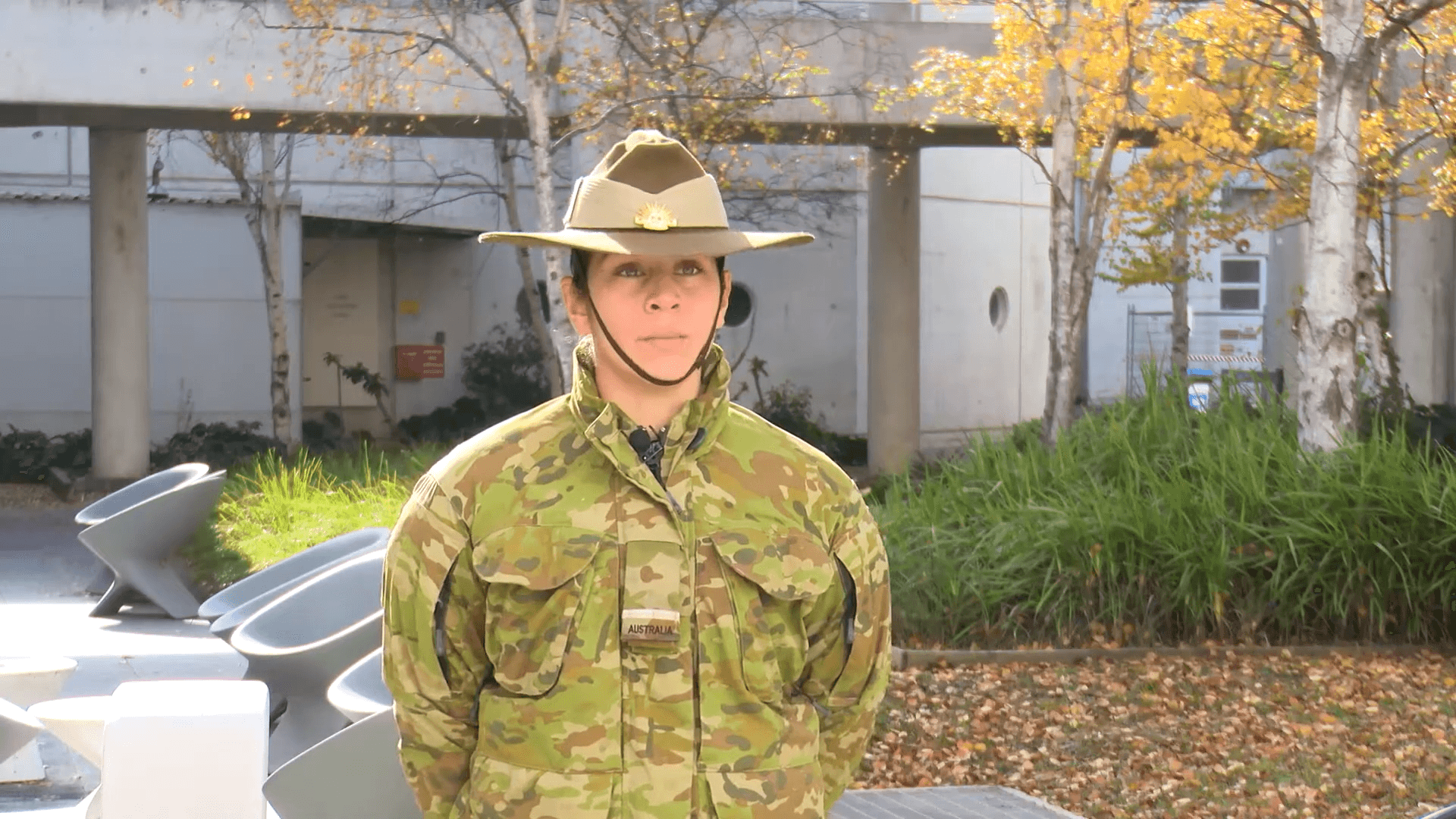 Cadet in uniform outside. 