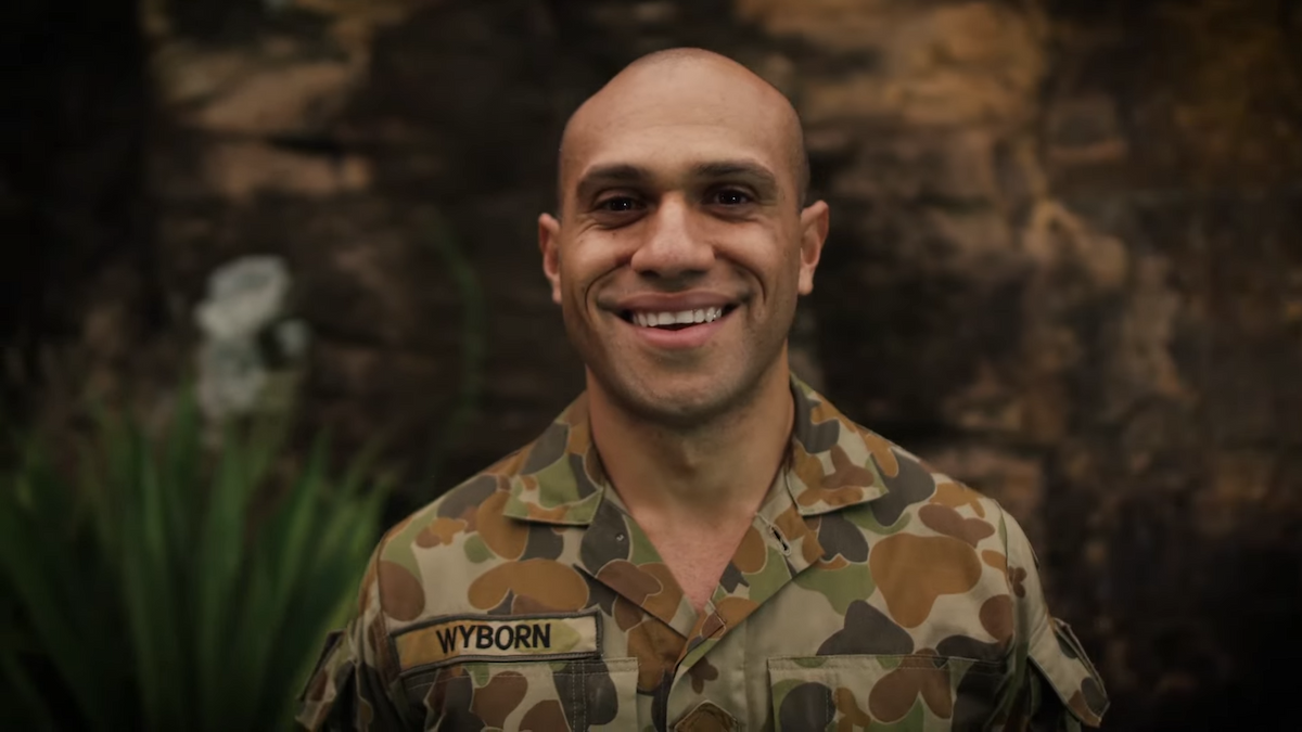 A male Army Reservist smiles at camera.